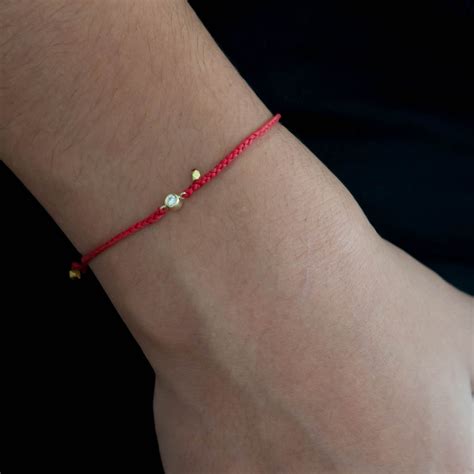 red string bracelet with diamond